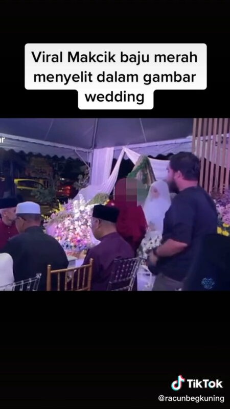 ‘Makcik baju merah’ menyelit dalam foto dan video nikah