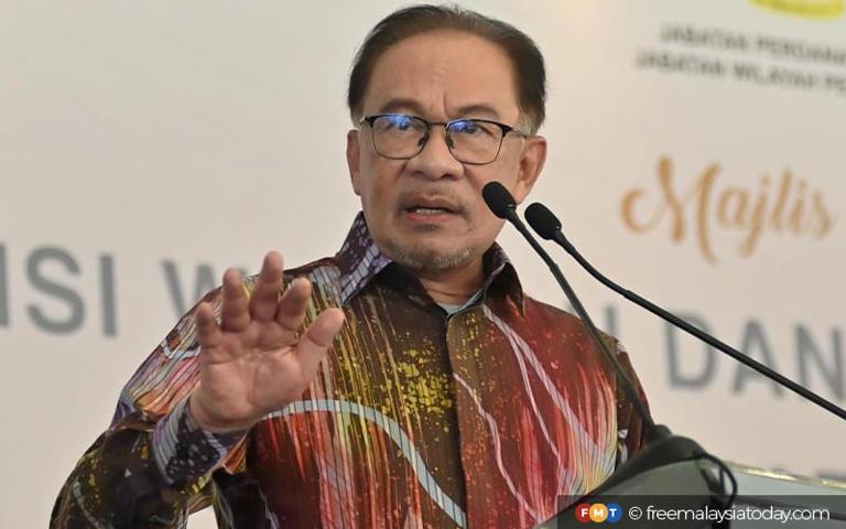 Focus on your court case, Anwar tells Muhyiddin