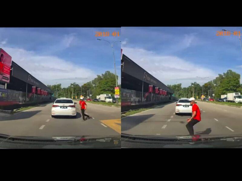 [VIDEO] Lelaki baju merah lintas jalan, lompat arah kereta bergerak